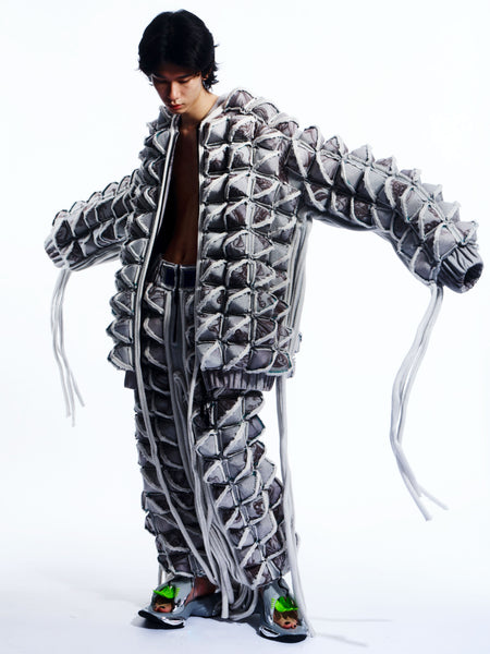GRAPHIC SPIKED DEFENCE COAT WITH FRINGING